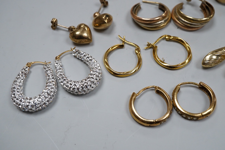 Nine pairs of earrings, comprising: seven hoop earrings, two of which set with pastes; and two pairs of drop earrings, six with British hallmarks for 9ct gold combined gross weight approximately 18 grams, three variously